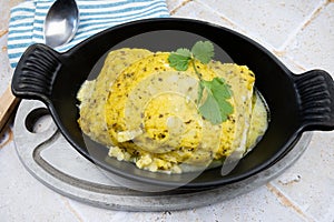 Dish of hake ÃÂ  la bordelaise on a table